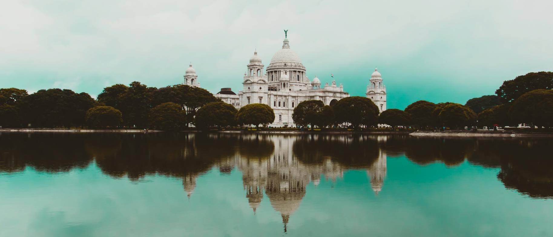 Victoria Memorial casting its shadow in the river nearby, Kolkata, India